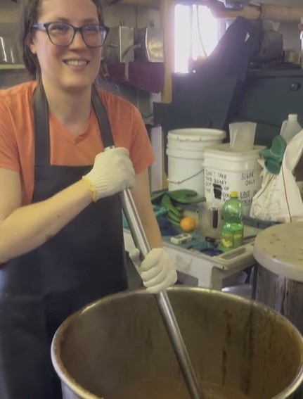 Katlyn Bauman stirring apple butter